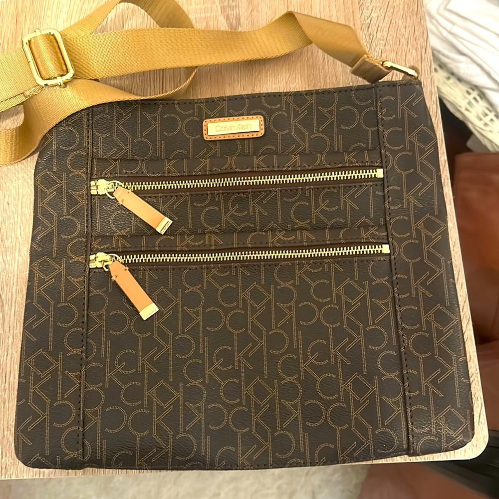 Calvin Klein purse with three outside pockets